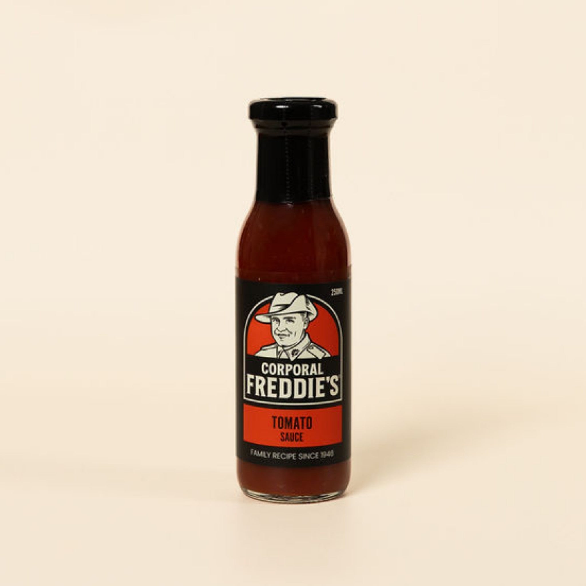 Bottle of Corporal Freddie's Tomato Sauce on a beige background