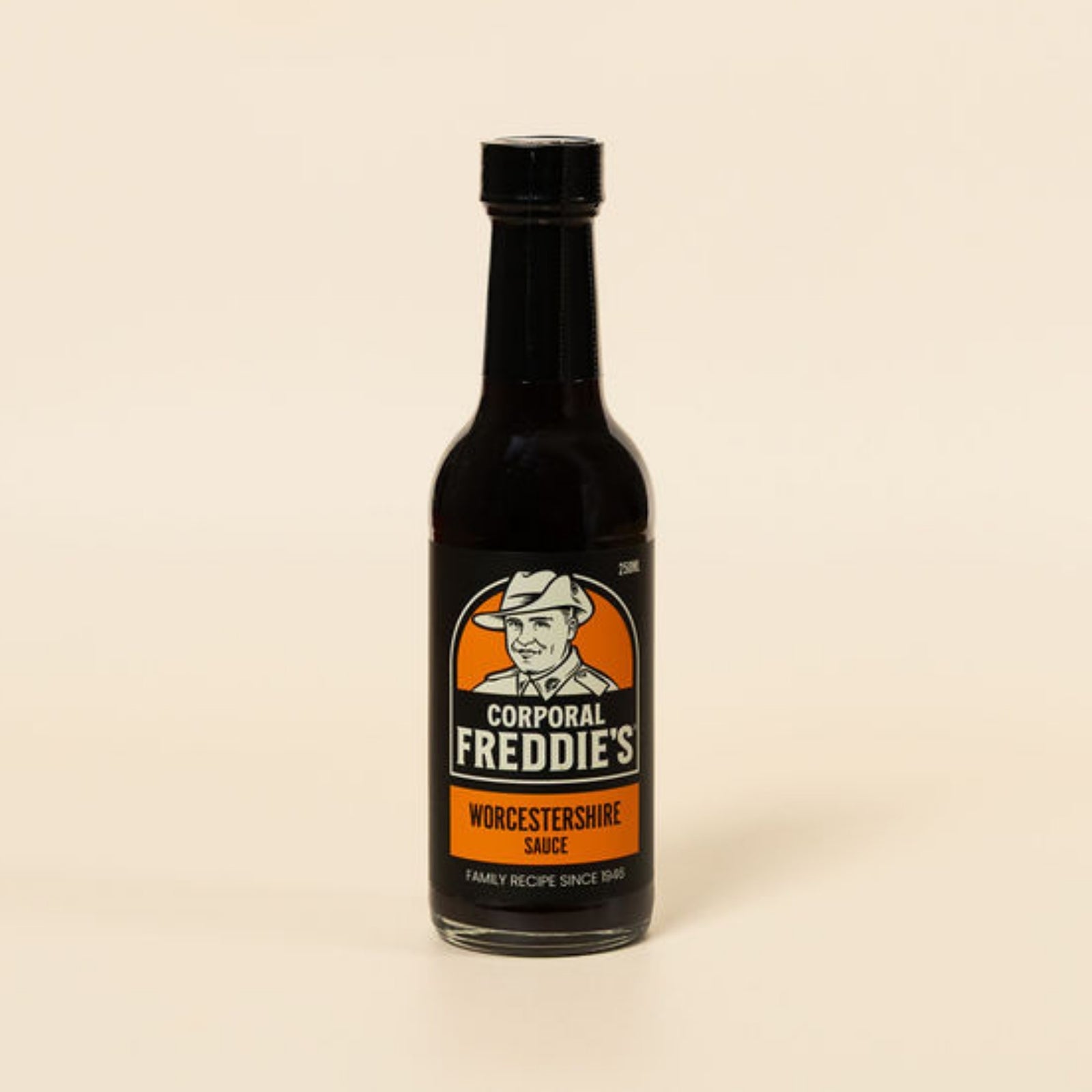 Bottle of Corporal Freddie's Worcestershire sauce on a beige background